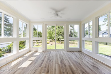 Experience refined coastal living at 387 Blossom Tree Lane SE on Carolina National Golf Club in North Carolina - for sale on GolfHomes.com, golf home, golf lot