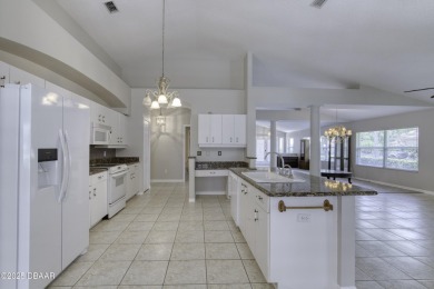 Welcome home to this beautifully maintained 3-bedroom on Plantation Bay Golf and Country Club in Florida - for sale on GolfHomes.com, golf home, golf lot