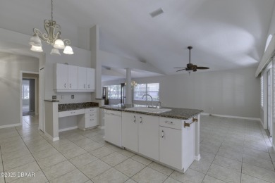 Welcome home to this beautifully maintained 3-bedroom on Plantation Bay Golf and Country Club in Florida - for sale on GolfHomes.com, golf home, golf lot