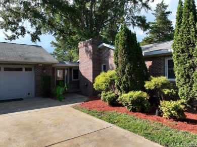 Reasonably priced Lake Gaston home with launch ramp behind the on Myrick Hills Country Club in North Carolina - for sale on GolfHomes.com, golf home, golf lot