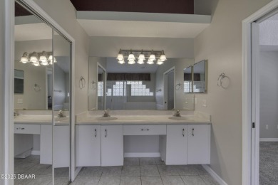 Welcome home to this beautifully maintained 3-bedroom on Plantation Bay Golf and Country Club in Florida - for sale on GolfHomes.com, golf home, golf lot