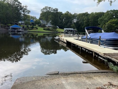 Reasonably priced Lake Gaston home with launch ramp behind the on Myrick Hills Country Club in North Carolina - for sale on GolfHomes.com, golf home, golf lot