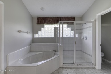 Welcome home to this beautifully maintained 3-bedroom on Plantation Bay Golf and Country Club in Florida - for sale on GolfHomes.com, golf home, golf lot