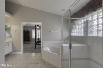 Welcome home to this beautifully maintained 3-bedroom on Plantation Bay Golf and Country Club in Florida - for sale on GolfHomes.com, golf home, golf lot