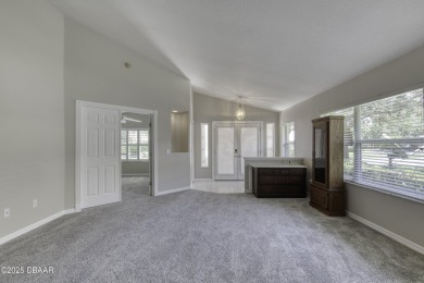 Welcome home to this beautifully maintained 3-bedroom on Plantation Bay Golf and Country Club in Florida - for sale on GolfHomes.com, golf home, golf lot