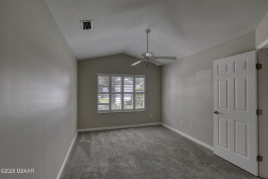 Welcome home to this beautifully maintained 3-bedroom on Plantation Bay Golf and Country Club in Florida - for sale on GolfHomes.com, golf home, golf lot