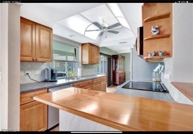 Charming single-family home located at 421 Marathon Ct, Naples on Lakewood Country Club in Florida - for sale on GolfHomes.com, golf home, golf lot