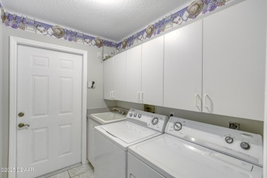 Welcome home to this beautifully maintained 3-bedroom on Plantation Bay Golf and Country Club in Florida - for sale on GolfHomes.com, golf home, golf lot