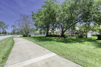Welcome home to this beautifully maintained 3-bedroom on Plantation Bay Golf and Country Club in Florida - for sale on GolfHomes.com, golf home, golf lot