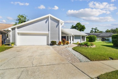 Your DREAM home awaits in the heart of beautiful CARROLLWOOD on Carrollwood Country Club in Florida - for sale on GolfHomes.com, golf home, golf lot
