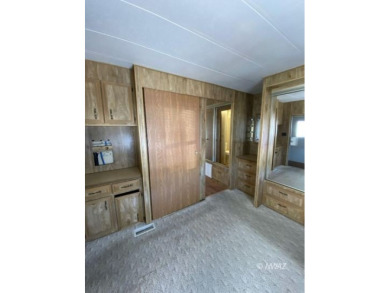 This manufactured home in Beaver Dam Resorts is an inviting on Beaver Dam Resort in Arizona - for sale on GolfHomes.com, golf home, golf lot