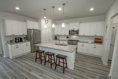 Nestled on the scenic fairways of The Island golf community on The Island Country Club in Louisiana - for sale on GolfHomes.com, golf home, golf lot