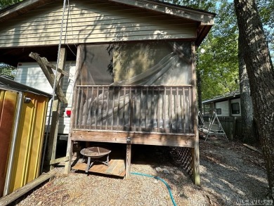 You will not want to miss this treat! Large porch with bar and on River Ridge Golf Club in Virginia - for sale on GolfHomes.com, golf home, golf lot