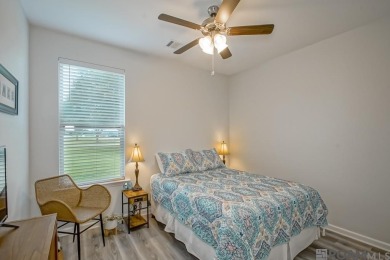 Nestled on the scenic fairways of The Island golf community on The Island Country Club in Louisiana - for sale on GolfHomes.com, golf home, golf lot