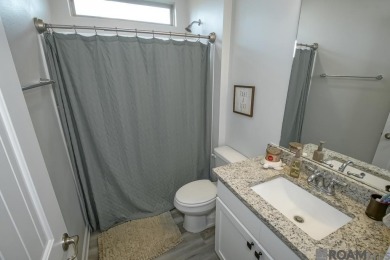Nestled on the scenic fairways of The Island golf community on The Island Country Club in Louisiana - for sale on GolfHomes.com, golf home, golf lot