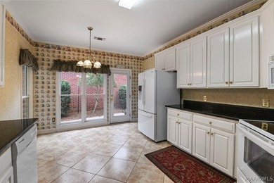 TOWNE LAKE home with peaceful WATERFRONT views of the canal and on Arrowhead Country Club in Alabama - for sale on GolfHomes.com, golf home, golf lot