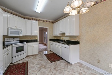 TOWNE LAKE home with peaceful WATERFRONT views of the canal and on Arrowhead Country Club in Alabama - for sale on GolfHomes.com, golf home, golf lot