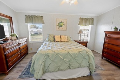 Well-designed 3/2 split bedroom home featuring spacious living on Barefoot Bay Golf Course in Florida - for sale on GolfHomes.com, golf home, golf lot