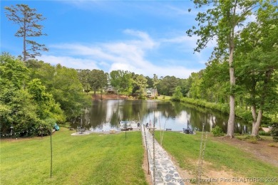 Are you looking for a gorgeous waterfront property? If so on Carolina Trace Country Club in North Carolina - for sale on GolfHomes.com, golf home, golf lot