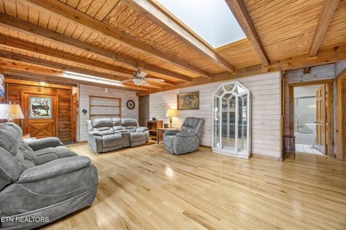 Discover a light-filled Jim Barna log home designed for quiet on Heatherhurst Golf Course in Tennessee - for sale on GolfHomes.com, golf home, golf lot