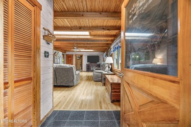 Discover a light-filled Jim Barna log home designed for quiet on Heatherhurst Golf Course in Tennessee - for sale on GolfHomes.com, golf home, golf lot