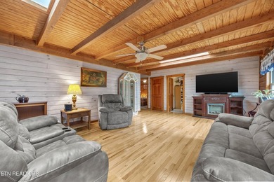 Discover a light-filled Jim Barna log home designed for quiet on Heatherhurst Golf Course in Tennessee - for sale on GolfHomes.com, golf home, golf lot