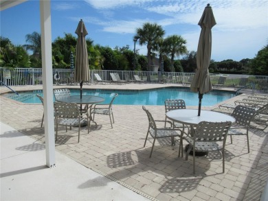 A 2/3 bedroom, 2 bath villa with wonderful lake views and a on Sabal Trace Golf and Country Club in Florida - for sale on GolfHomes.com, golf home, golf lot