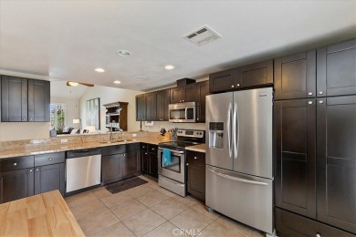Sitting just off the 17th green and ideally located within the on Palm Valley Country Club in California - for sale on GolfHomes.com, golf home, golf lot