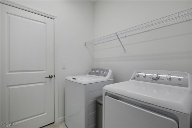 What a stunning newer construction home available here in on River Hall Country Club in Florida - for sale on GolfHomes.com, golf home, golf lot