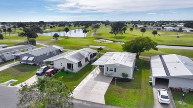 2bed/2bath home with a lovely golf course view in Barefoot Bay! on Barefoot Bay Golf Course in Florida - for sale on GolfHomes.com, golf home, golf lot