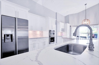 Luxury Turn Key is golf cart distance to WEF! This gorgeous on The Wanderers Club in Florida - for sale on GolfHomes.com, golf home, golf lot