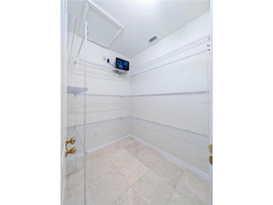 One or more photo(s) has been virtually staged. WATERFRONT on Saint Andrews South Golf Club in Florida - for sale on GolfHomes.com, golf home, golf lot