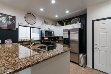 Discover comfort, style, and convenience in this fully furnished on London Bridge Golf Course in Arizona - for sale on GolfHomes.com, golf home, golf lot