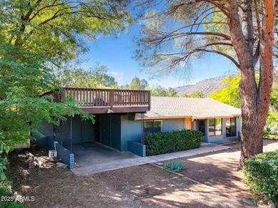 Charming house nestled among mature trees on a quiet street on Canyon Mesa Country Club in Arizona - for sale on GolfHomes.com, golf home, golf lot