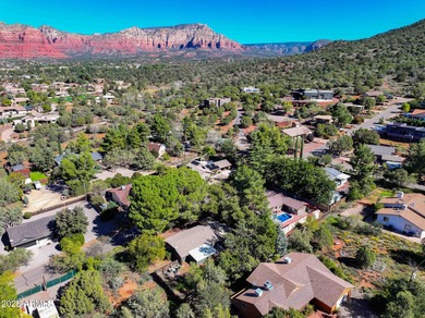 Charming house nestled among mature trees on a quiet street on Canyon Mesa Country Club in Arizona - for sale on GolfHomes.com, golf home, golf lot