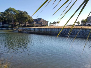 New price! Welcome to your dream waterfront lifestyle! Nestled on Pensacola Country Club in Florida - for sale on GolfHomes.com, golf home, golf lot