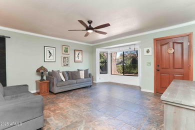 Charming house nestled among mature trees on a quiet street on Canyon Mesa Country Club in Arizona - for sale on GolfHomes.com, golf home, golf lot