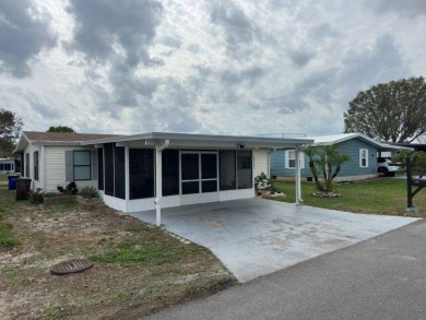 Incredible Opportunity - Resort-like Lifestyle!    This home is on Lake Henry Golf Club in Florida - for sale on GolfHomes.com, golf home, golf lot