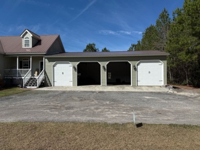 This stunning property, situated on 22 acres in the Lowcountry on Penny Branch Club in South Carolina - for sale on GolfHomes.com, golf home, golf lot