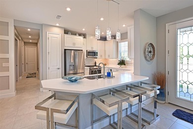 Welcome to resort-style living in Esplanade at Azario. This on Esplanade Golf and Country at Lakewood Ranch in Florida - for sale on GolfHomes.com, golf home, golf lot