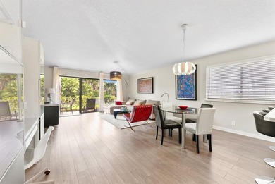 Impeccably updated 2-bed / 2-bath home in the desirable Club on PGA National Golf Club in Florida - for sale on GolfHomes.com, golf home, golf lot