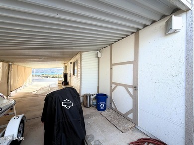 Up-close panoramic lake views right from your front patio inside on London Bridge Golf Course in Arizona - for sale on GolfHomes.com, golf home, golf lot