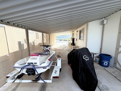 Up-close panoramic lake views right from your front patio inside on London Bridge Golf Course in Arizona - for sale on GolfHomes.com, golf home, golf lot
