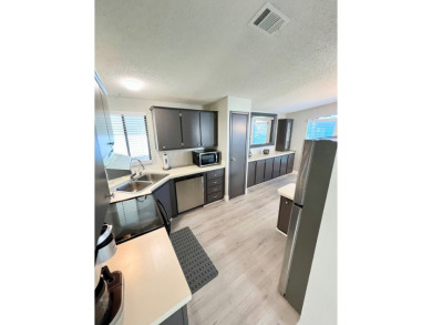 Welcome to this beautifully maintained two-bedroom, two-bath on Lake Fairways Country Club in Florida - for sale on GolfHomes.com, golf home, golf lot