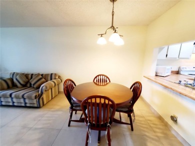 BEAUTIFUL MOVE IN READY, PARTIALLY FURNISHED 2/2 THIRD FLOOR on Sunrise Lakes Phase IV Golf Course in Florida - for sale on GolfHomes.com, golf home, golf lot