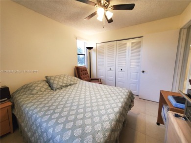 BEAUTIFUL MOVE IN READY, PARTIALLY FURNISHED 2/2 THIRD FLOOR on Sunrise Lakes Phase IV Golf Course in Florida - for sale on GolfHomes.com, golf home, golf lot