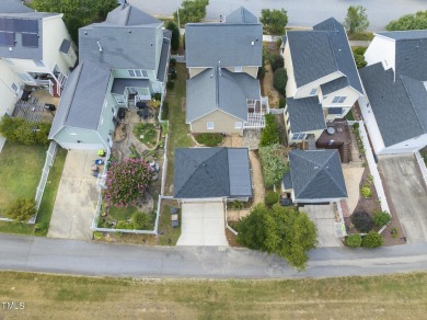 Explore this charming Charleston-style home in Sunset Ridge on Devils Ridge Golf Club in North Carolina - for sale on GolfHomes.com, golf home, golf lot