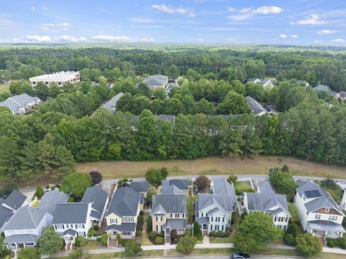 Explore this charming Charleston-style home in Sunset Ridge on Devils Ridge Golf Club in North Carolina - for sale on GolfHomes.com, golf home, golf lot