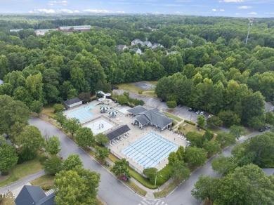 Explore this charming Charleston-style home in Sunset Ridge on Devils Ridge Golf Club in North Carolina - for sale on GolfHomes.com, golf home, golf lot