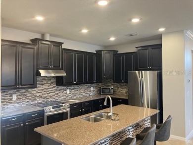 Welcome to this beautifully maintained home, 4 bedrooms 3 baths on Summerfield Crossing Golf Club in Florida - for sale on GolfHomes.com, golf home, golf lot